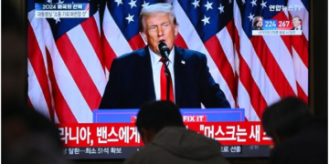 Trump makes first cabinet pick, eyes Putin talks