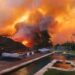 Thousands flee as Los Angeles wildfires burn out of control