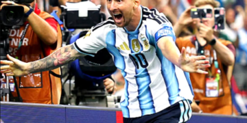 Messi double sends Argentina into knockout stage