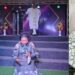 Eucharia Anunobi kneels in church to beg for donations for ailing colleague Ngozi Nwosu